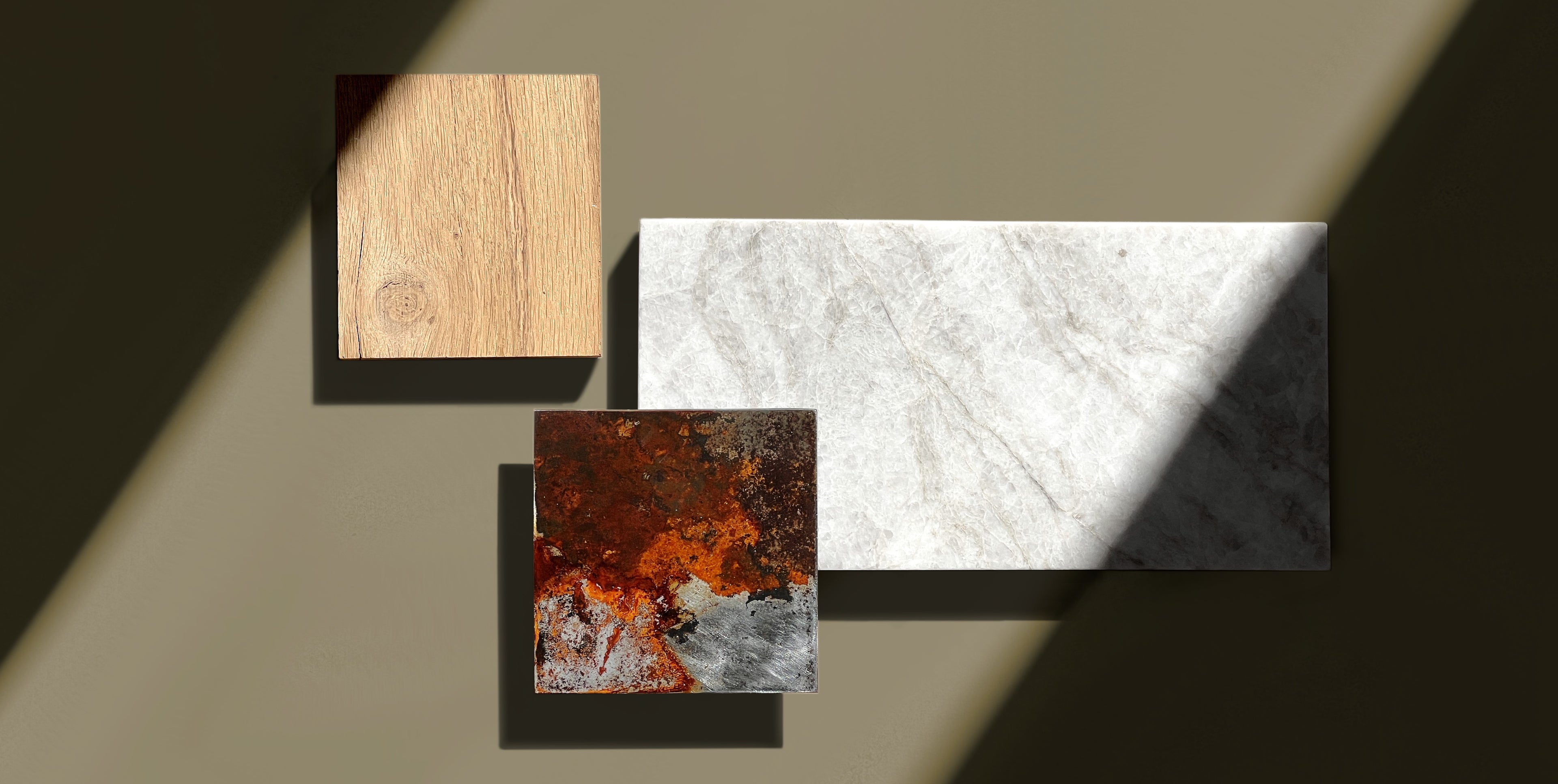 Geometric moodboard showing rusted steel, oak wood, and white marble samples – material palette for contemporary luxury interiors.