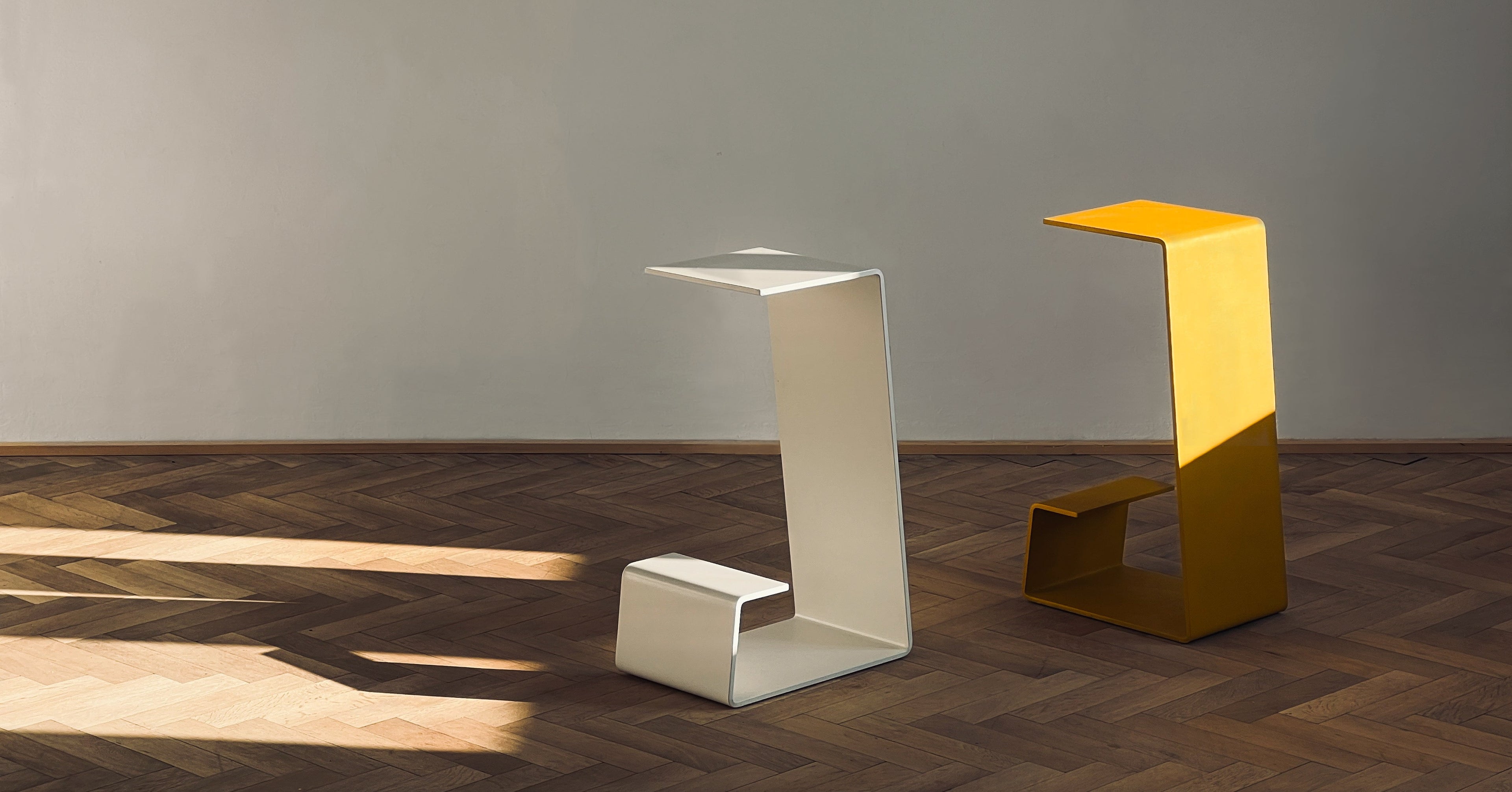 THE PURE Bar Stools in Foam White and Bee Yellow – minimalist luxury kitchen stools on oak parquet floor